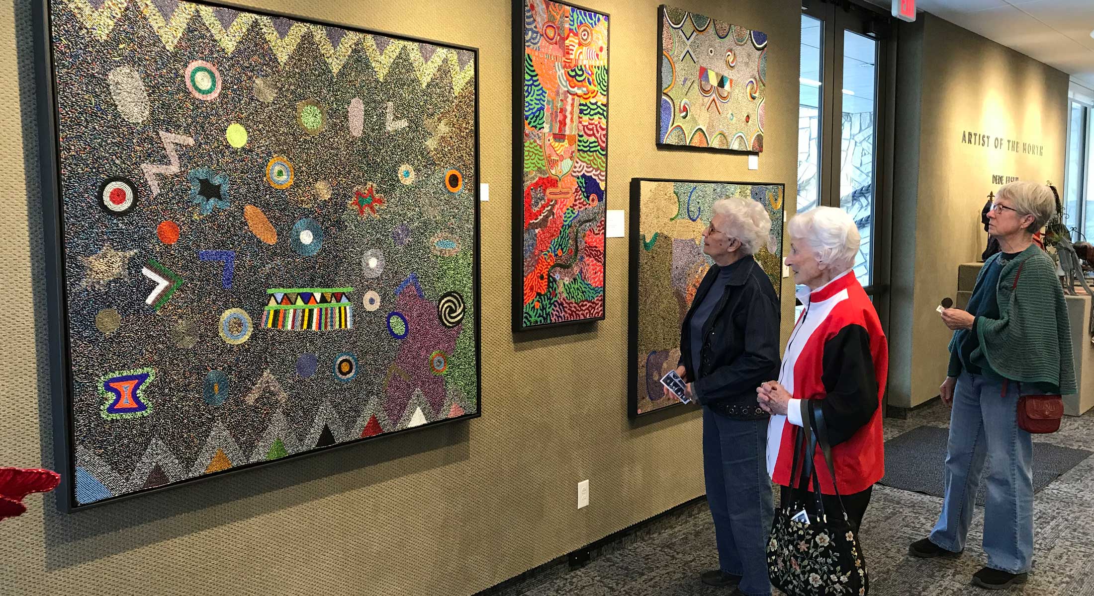 Visitors enjoying an exhibit at the Hansen Museum