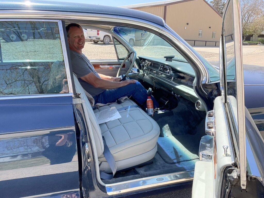 Dave riding high in Mr. Hansen's 1961 Cadillac DeVille