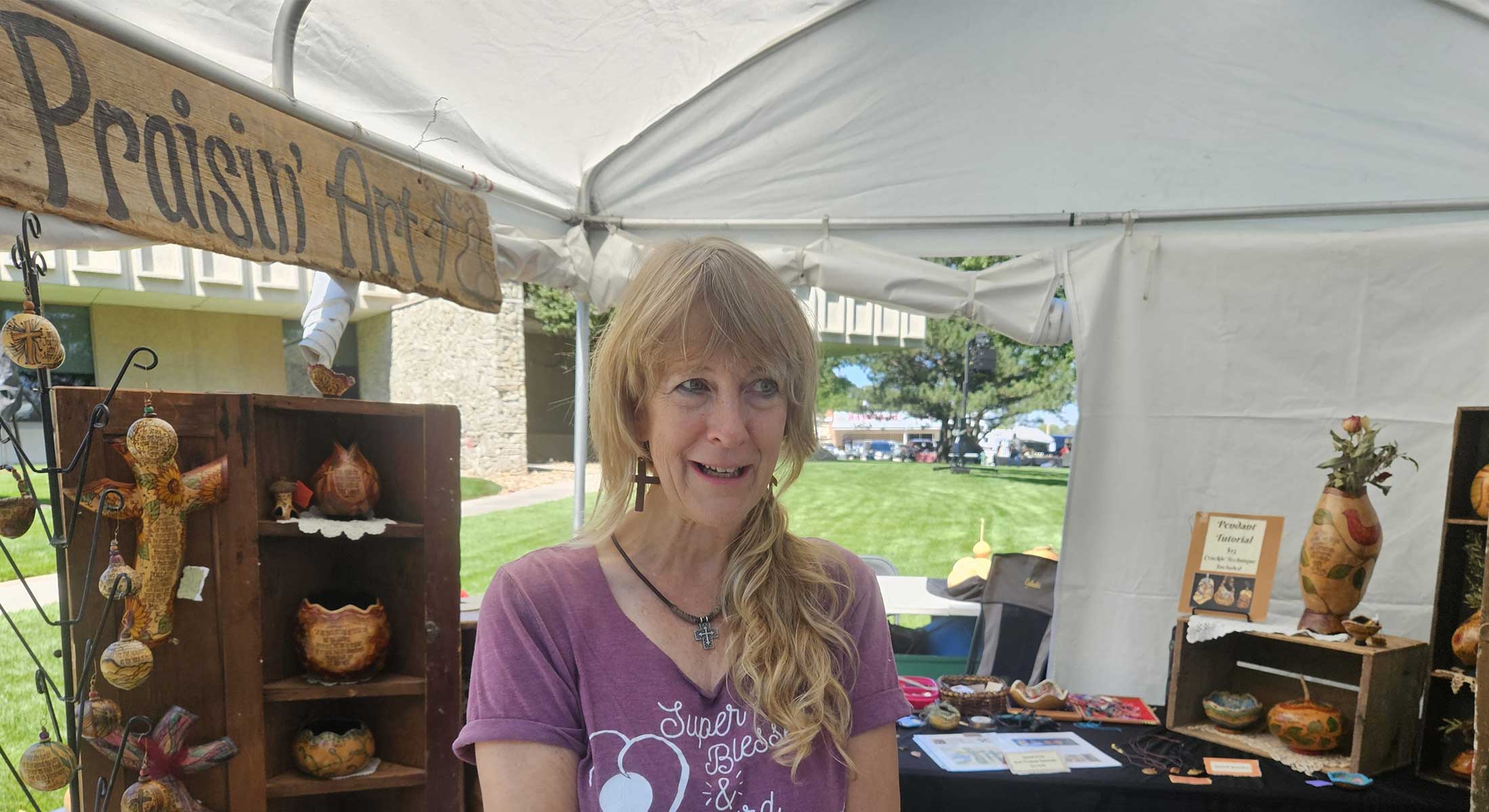 July Artist of the Month, Kristin Johnson, with her booth at the 2024 Arts and Crafts Fair July Artist of the Month, Kristin Johnson, with her booth at the 2024 Arts and Crafts Fair